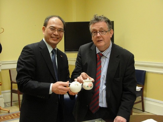 Representative Harry Tseng presents Dr. Patrick Wallace