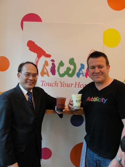 Representative Harry Tseng shares a bubble tea with