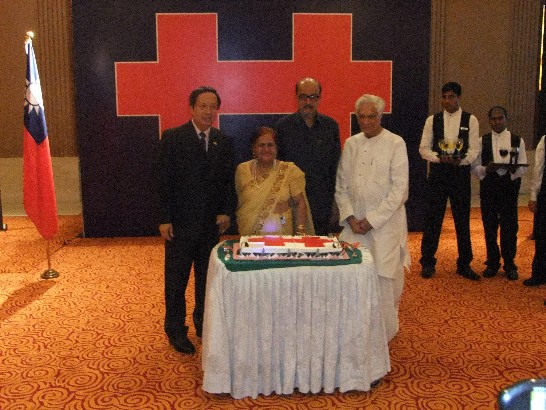 Ambassador Ong cut the Double Tenth cake with Prof. Lokesh Chandra, Mr. Ramen Deka, and Mrs. Swarup .