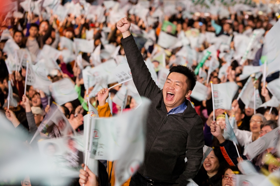 Democratic Progressive Party presidential candidate Tsai Ing-wen’s supporters roar with excitement as they watch the vote count broadcast live at her campaign