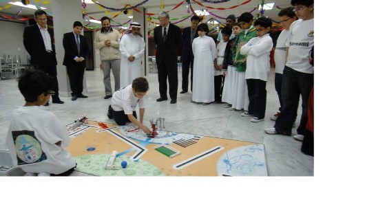 Kingdom Cshool Students operate robots