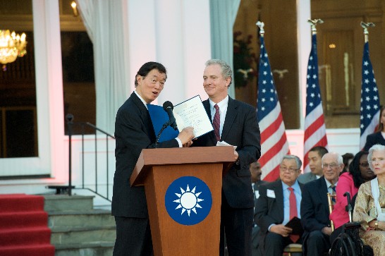 Representative of the Taipei Economic and Cultural Representative Office in the United States Lyushun Shen, left, receives a proclamation from Rep. Chris van Hollen (D-MD) for the 103rd National Day celebration of the Republic of China (Taiwan) at the Twin Oaks Estate.