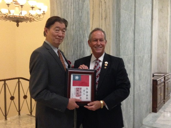 Rep. Lyushun Shen of the Republic of China (Taiwan) presents the famous “blood chit” of the Flying Tigers to Rep. Joe Wilson (R-SC), honoring his father’s service as a Flying Tiger aviator in China during WW II.