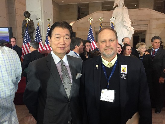 Representative Lyushun Shen and Jeff Thatcher, son of David Thatcher, who is one of the only two still surviving crew members of the Doolittle Tokyo Raiders, at the Congressional Gold Medal Ceremony on April 15, 2015.