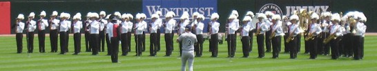 Chien Kuo High School Band on the field at U.S. Cellular Park play the U.S. National Anthem