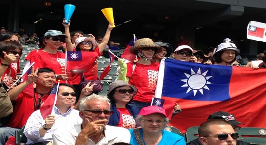 Director General Ho and Chien Kou H.S. Band fan group in the crowd at U.S. Cellular Park