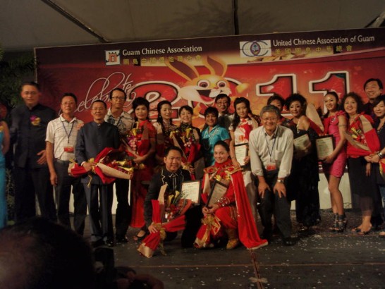 Director General Paul Wang, Speaker Judith Won Pat (the back middle), Mr.Joseph Hsu(the front right 1),President of United Chinese Association of Guam, and Mr. James Qu(the back left 4), Acting President of Guam Chinese Association, with performers and members of two Associations