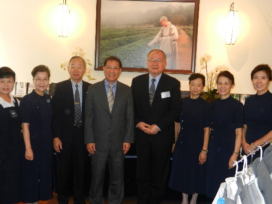 Director General Liao posing for pictures at the Tzu Chi Bookstore