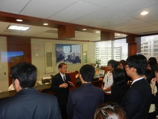 Director General Liao explains to visitors the new improvements made to the office for the benefit of those served in the community