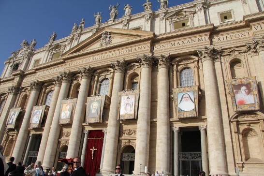 A view of the marble façade of St. Peter’s Basilica displaying the portraits of the new seven saints: Giacomo Berthieu, Pietro Calungsod, Giovanni Battista Piamarta, Maria Carmen Sallés y Barangueras, Marianna Cope, Caterina Tekakwitha, and Anna Schäffer.