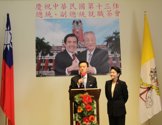 Ambassador Larry Wang addresses his guests next to his wife.