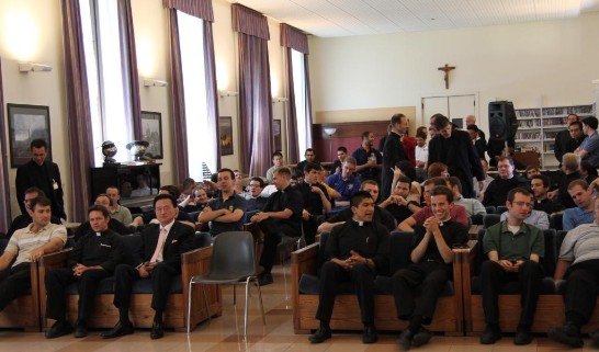 The public waits anxiously for the Youth Ambassadors to perform inside the Student Lounge. Ambassador Larry Wang sits on the first row (3rd from left).