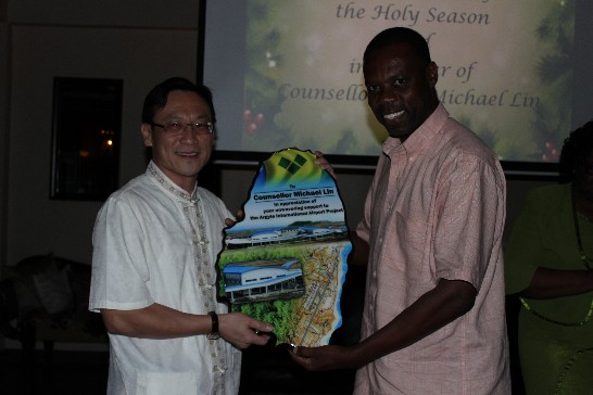 Dr. Rudy Matthias, Chief Execution Officer of the SVG International Airport Development Corporation (IADC), presented Counsellor Mr. Michael Lin a farewell gift.