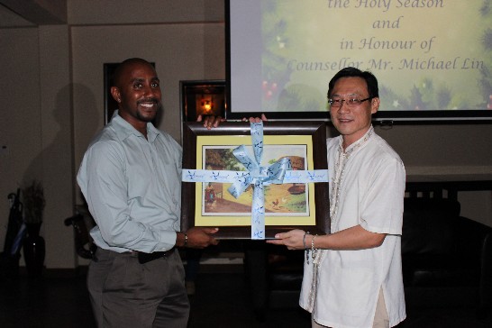 Hon. Glen Beache, the Chief Executive Officer of SVG Tourism Authority, presented Counsellor Mr. Michael Lin a farewell gift.