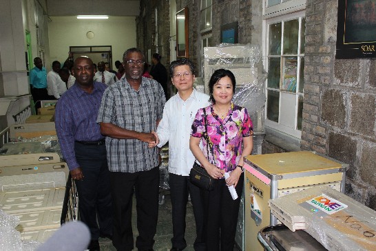 ROC (Taiwan) Ambassador Weber Shih shaked hand with SVG Health Minister Clayton Burgin, accompanied by Mrs. Joan Shih and Permanent Secretary Luis de Shong among the donated medical equipment from ROC (Taiwan) at Milton Cato Memorial Hospital  