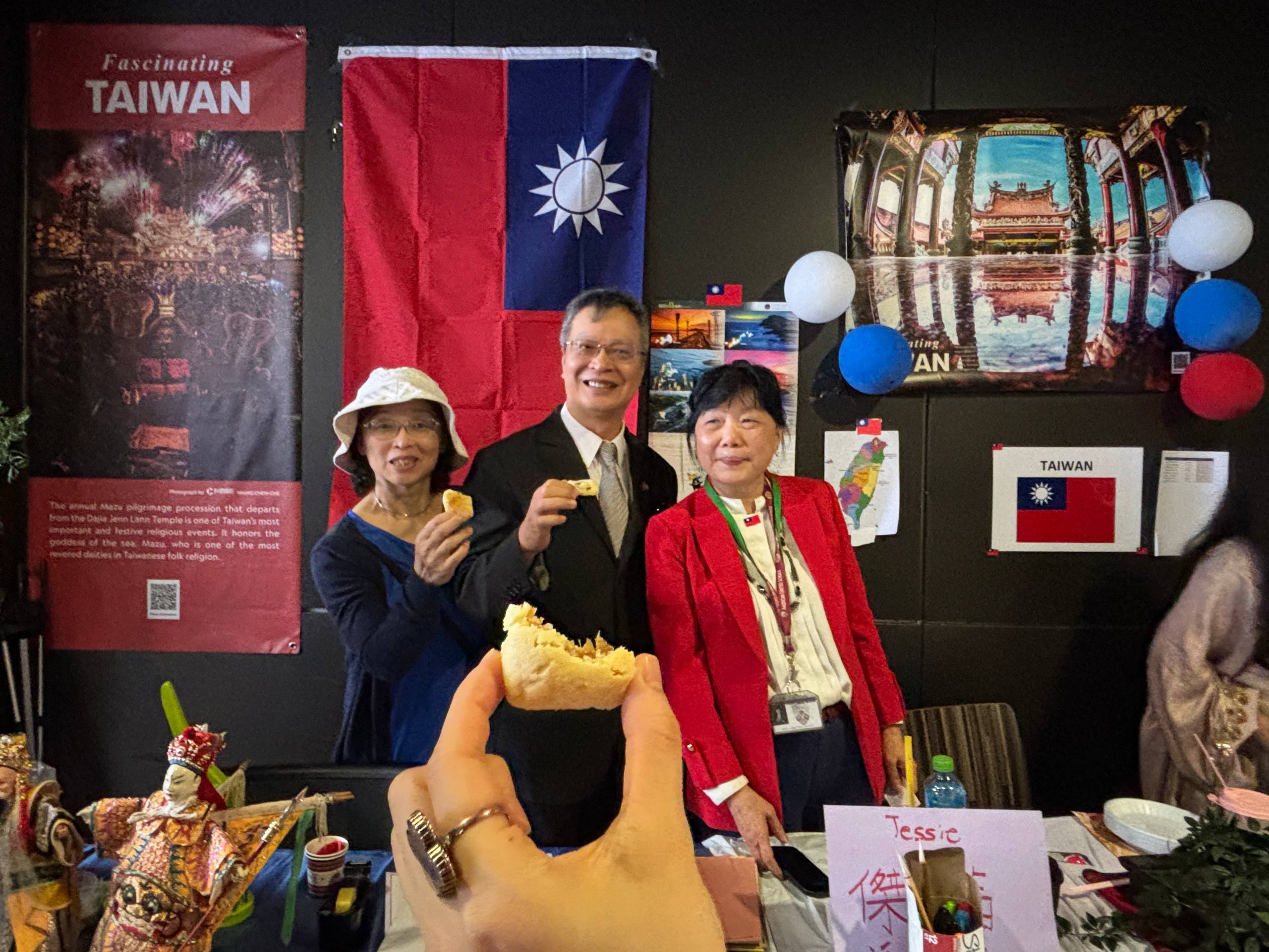 Representative Hu and his wife were invited to International Day Cultural Event and stopped by Taiwan stand and posed for a photo.
