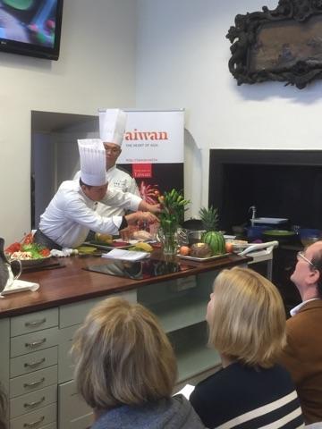 Professor Chen demonstrating his wonderful cooking and fruit carving skills to the audience at Howth Castle Cookery School