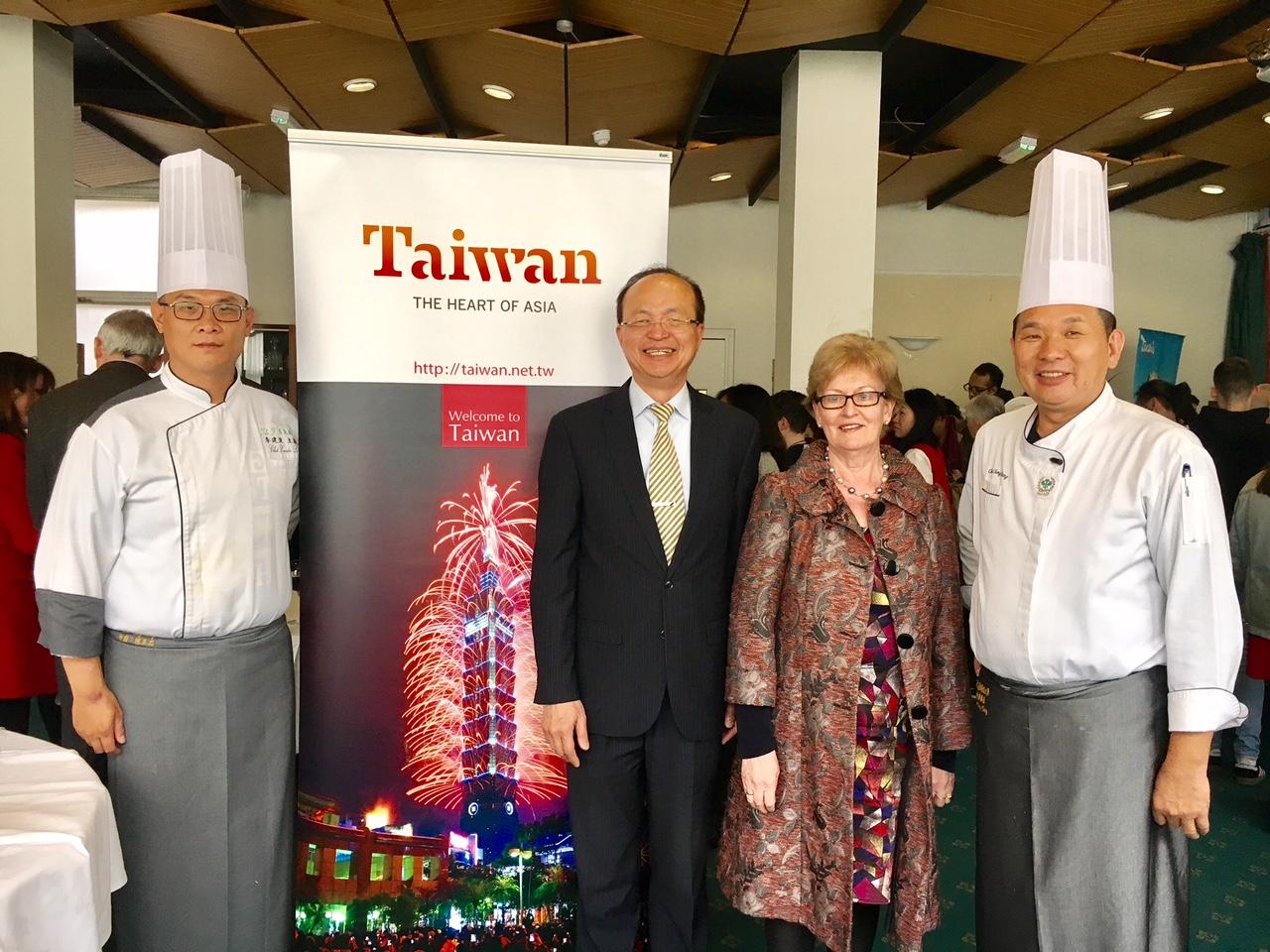 Representative Tu (centre), Professor Chen (right) and Mr. Li (left) at the reception with INGO representatives