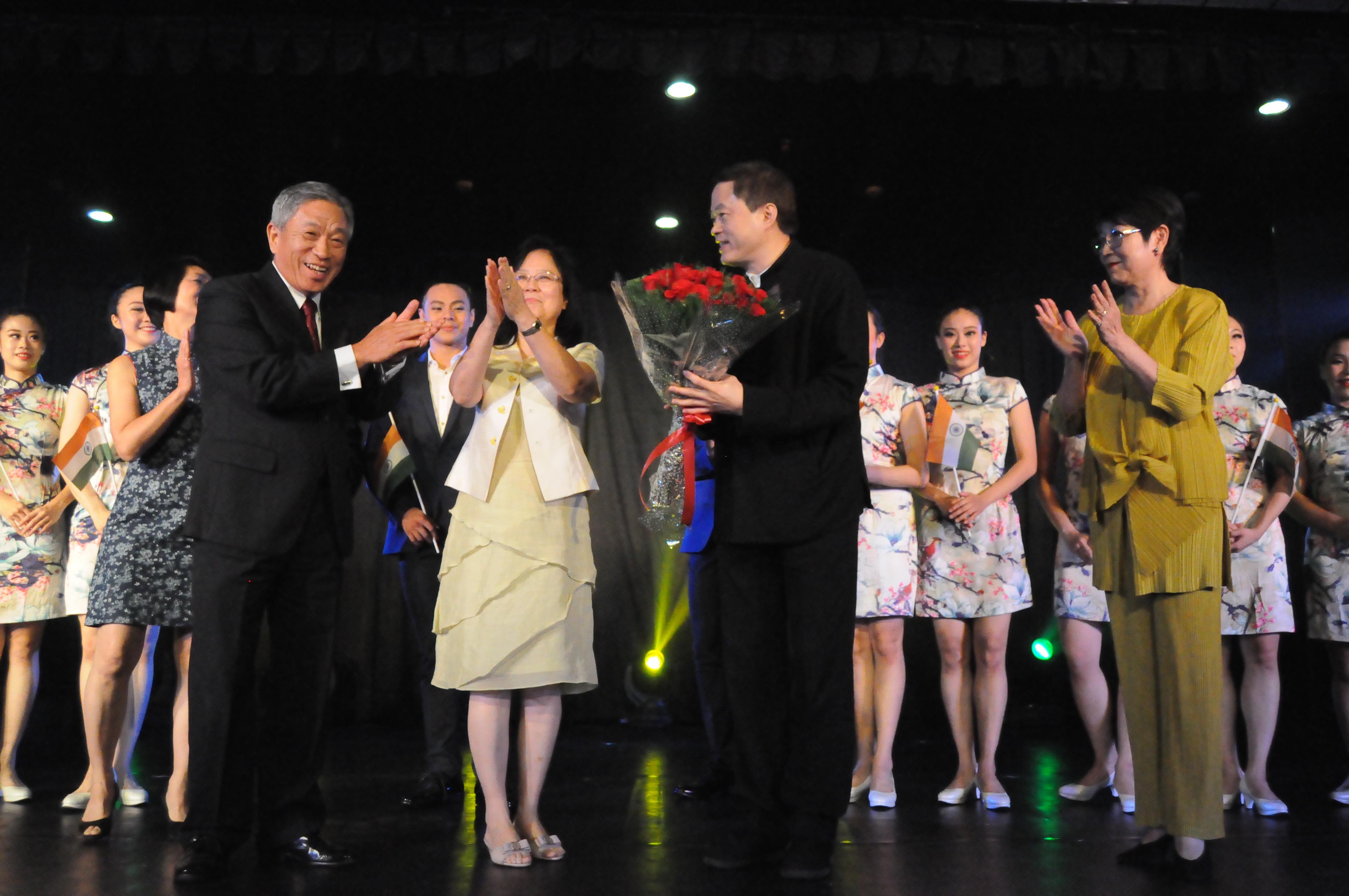 Amb. Tien and Madam Tien presented a bouquet to Dr. Chen.