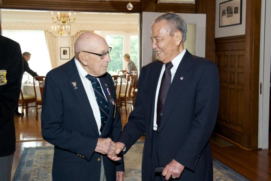 Lieutenant-Colonel Richard Cole (left) and General Patrick Chen greet one another at a luncheon held in their honor at the Twin Oaks Estate on May 19, 2015. General Chen, a member of the Flying Tigers, later became Deputy Commander-in-Chief of the Republic of China Air Force. Lt.-Col. Cole was co-pilot to Colonel James Doolittle for the Doolittle Tokyo Raid, the first operation to strike the Japanese homeland.