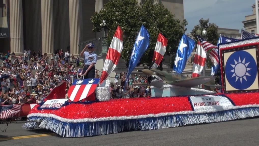General Patrick Chen, former Deputy Commander-in-Chief of the Republic of China (Taiwan) Air Force and a former Flying Tiger pilot, stands in front of a replica of the Curtiss P-40 Warhawk and the ROC national emblem on our float in the national Memorial Day parade in Washington, DC, on May 25, 2015. 