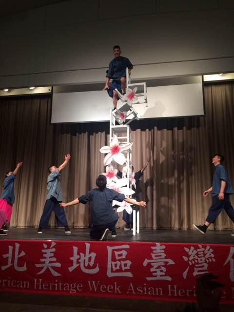 Acrobatic performance by Formosa Circus Arts Group featuring Hakka costume and music.