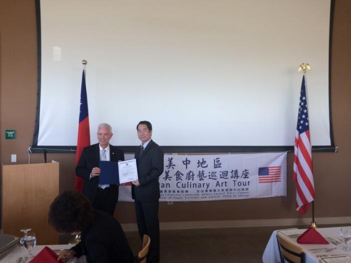Representative Bill Johnson (left) presents Proclamation to Director General Calvin Ho