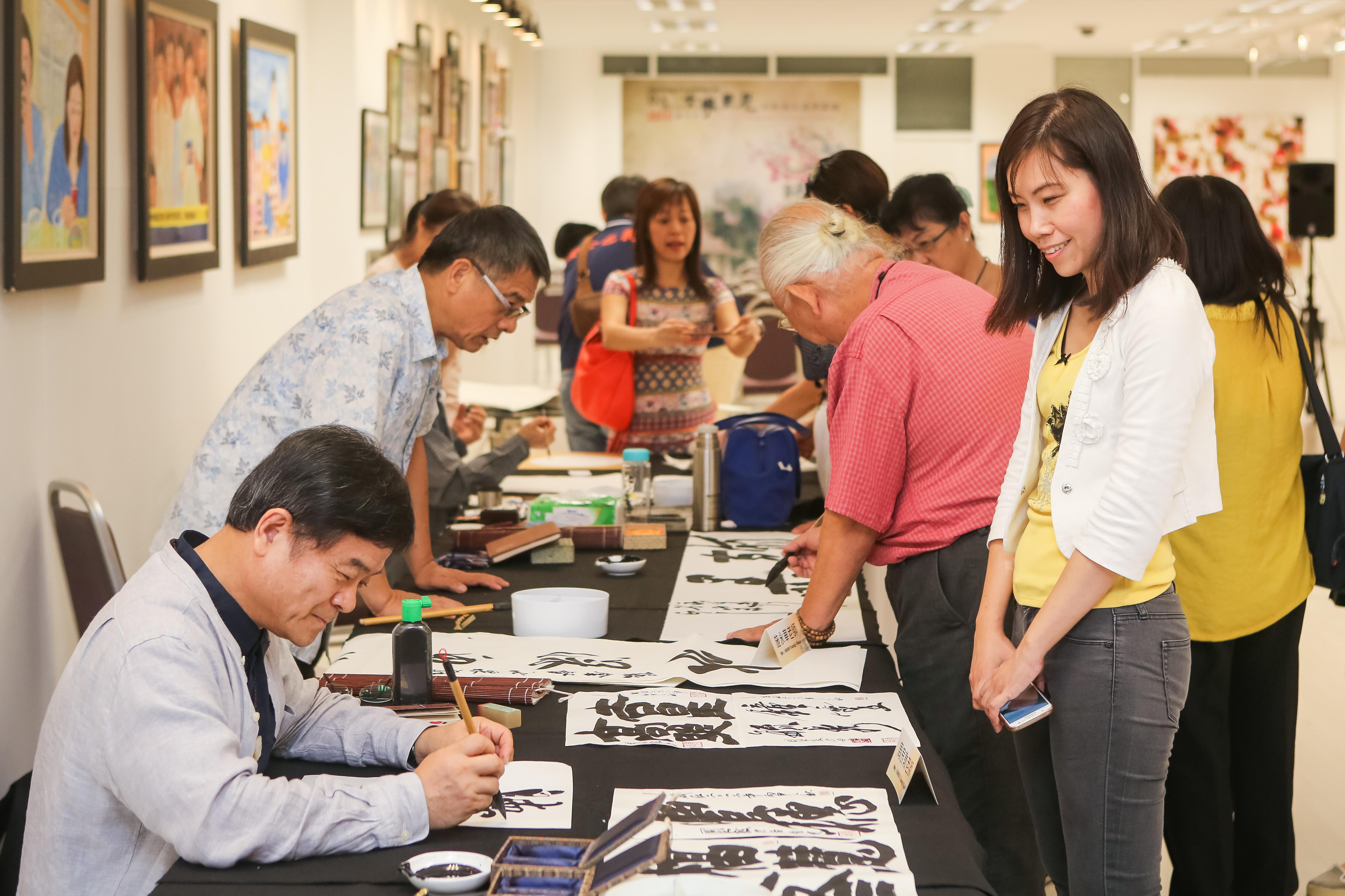 Four artists from Taiwan showcased their unique artworks in the demonstration of Chinese Calligraphy &amp; Chinese Ink Drawing session.


