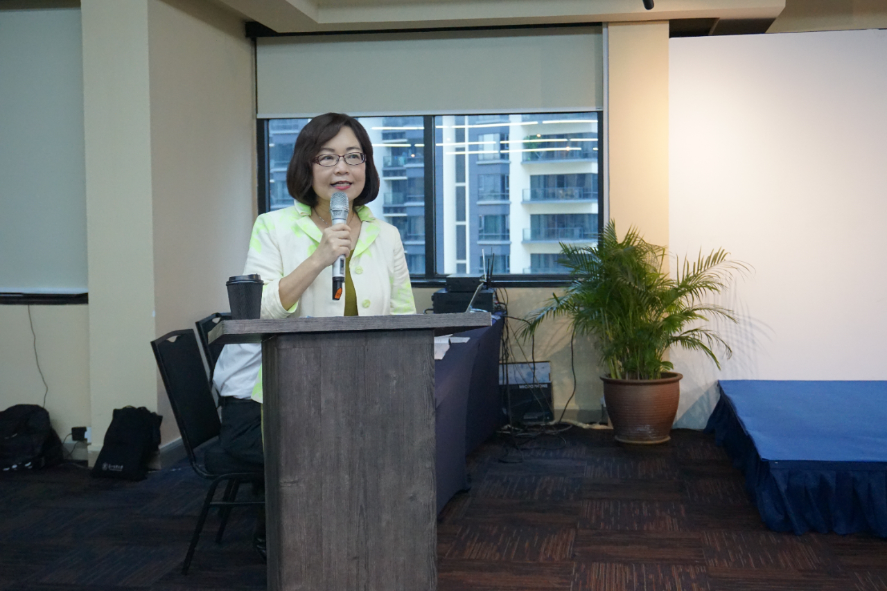 Representative Anne Hung delivers a speech