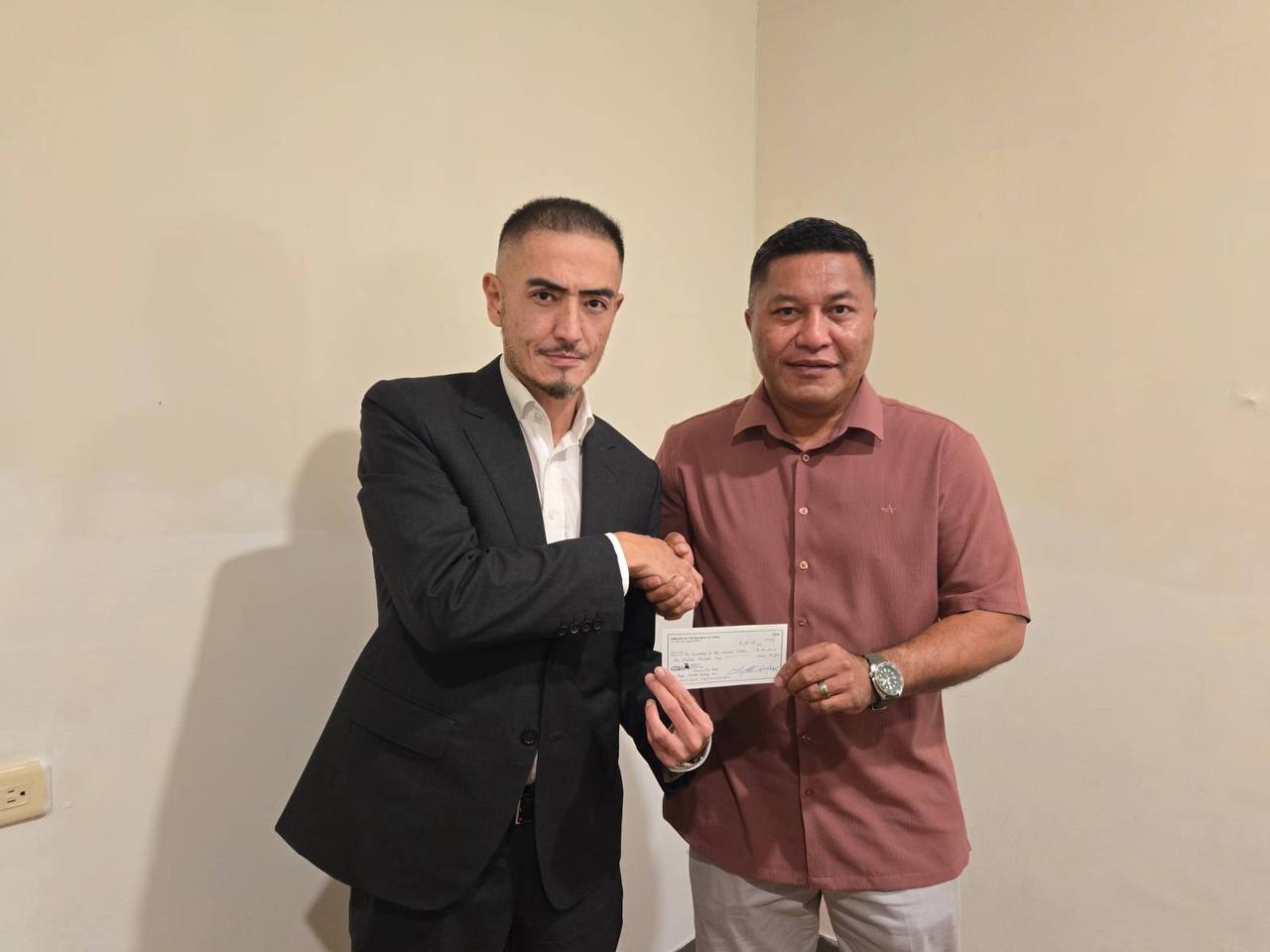 amb handsover the check