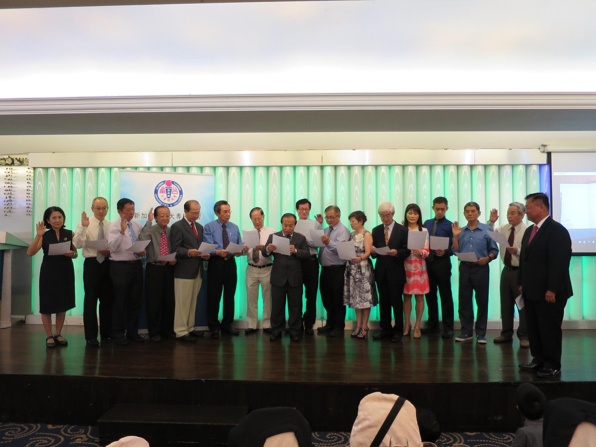 Representative Chang (extreme right) acting as Commissioner at the swearing in of the 21st Council of ATUC.